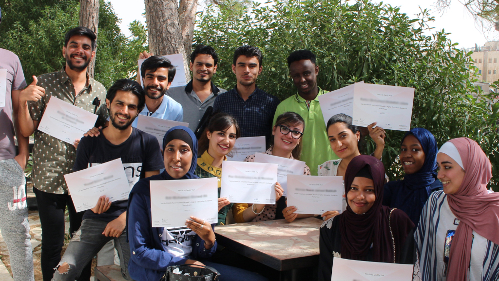 Students holding certificates